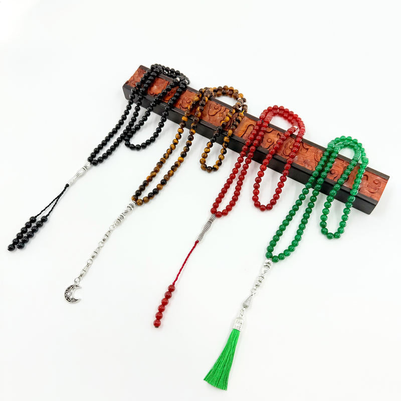 A curated collection of Tasbih and Misbaha (Islamic prayer beads) from Minbar, featuring Aqeeq agate, Tiger Eye, crystal, and resin designs for dhikr